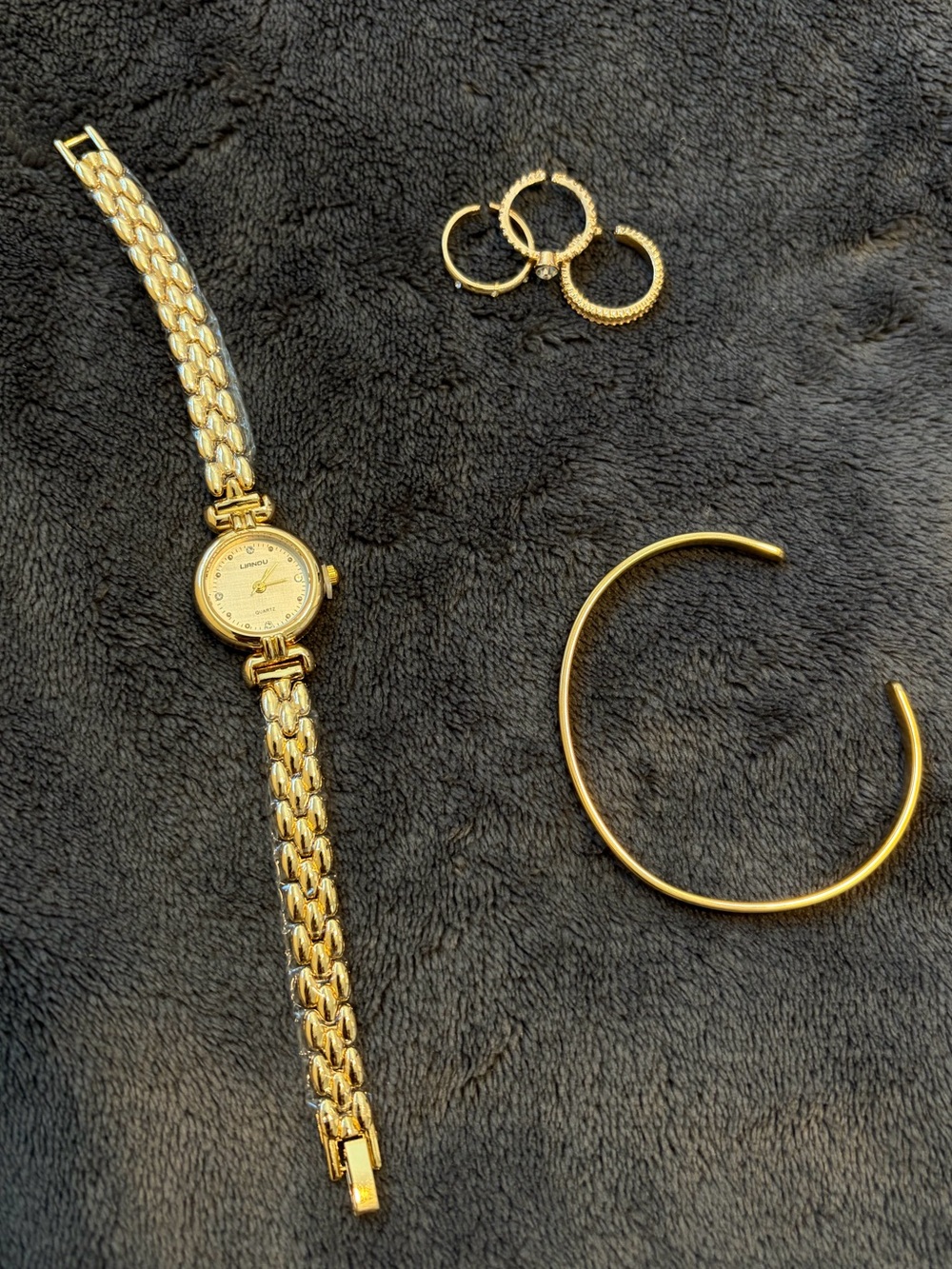 gold coloured jewelry set & watch